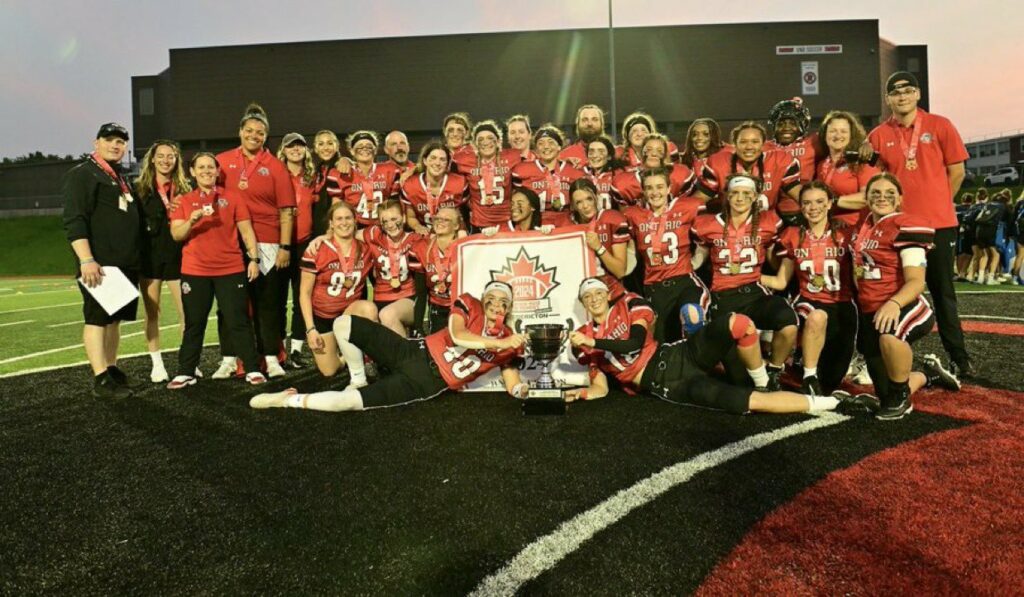 Team Red players and staff celebrating a U18 women’s championship