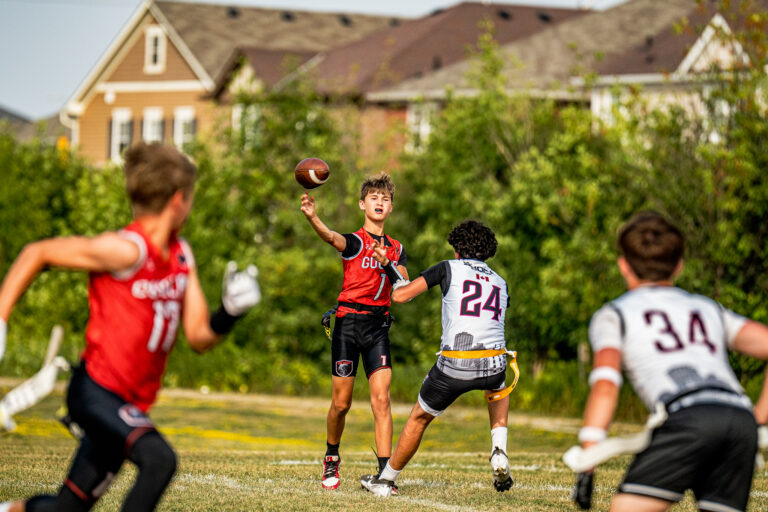 Young players learning to throw and catch at a First Down session