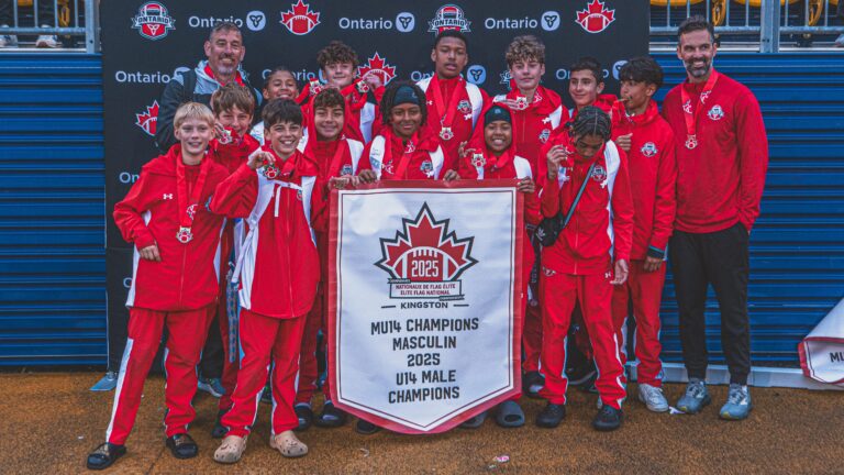 Team Ontario players with a national championship banner