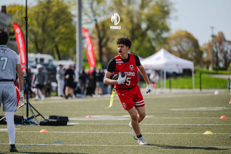 Adult flag football player running with the ball